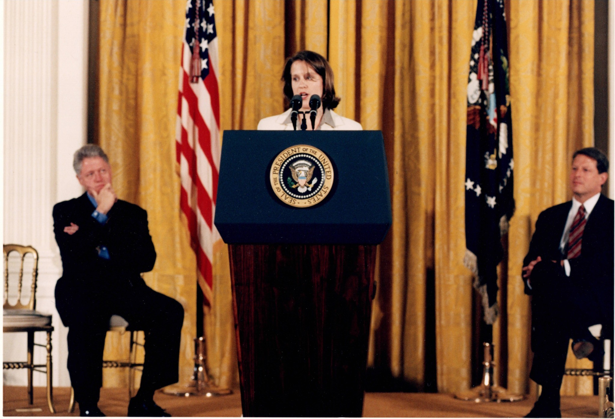 Macdara MacColl speaking at the White House in 1997, with President Bill Clinton and Vice President Al Gore looking on